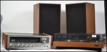 A retro 1970's Hitachi hi-fi stereo system with ac