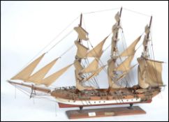 A 20th century retro model of a tall clipper sailing ship with notation plaque