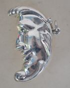 A 20th century silver plated half moon shaped vest