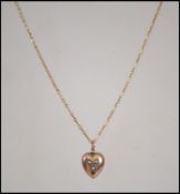An early 20th century 15ct gold pendant necklace s