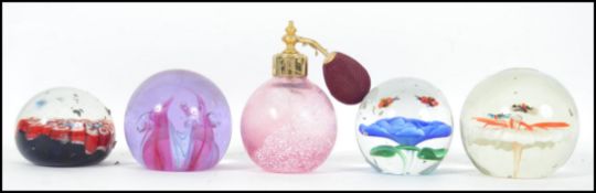 A collection of paperweights to include Caithness