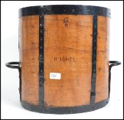 A large bentwood and iron mounted bushel grain mea