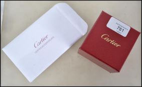 An original Cartier platinum band ring complete in