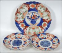A pair of 19th century Oriental Imari pattern plat