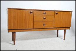 A 1970's retro Danish influenced teak wood sideboa