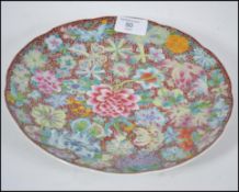A Chinese porcelain enamelled plate decorated with