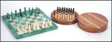 A vintage 20th century Malachite chess board and pieces ( complete ) together with a Yew wood