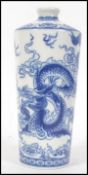 A Chinese blue and white vase decorated with a sinuous dragon pursuing a flaming pearl amidst