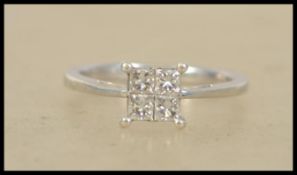 A 9ct white gold ladies 4 stone diamond ring havin