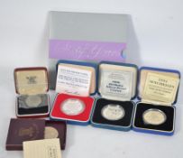 A collection of silver proof coins to include a 19
