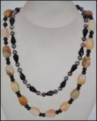 Two ladies necklaces, one set with agate and fresh