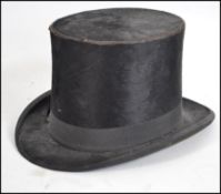 A vintage British Cash & Co Brushed Silk Top Hat.