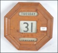 A 1930's Art Deco golden oak Octagonal  wall calen