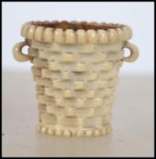 A 19th century intricately carved Ivory pin cushio