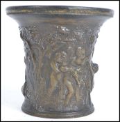 An 18th century cast bronze pot decorated with cla