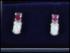 A pair of ladies silver, ruby and opal earrings of