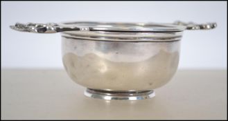 A Harrods silver hallmarked tea strainer  having t