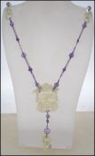 A Qing dynasty Chinese silk strung jade and amethy