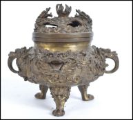 A Chinese lidded  bronze censor the pierced lid su