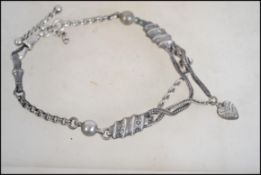 A believed Edwardian silver and white metal chatel