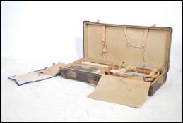 A vintage 1930's tennis set complete in the travel