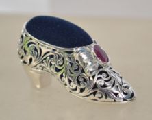 A substantial silver pin cushion in the form of a