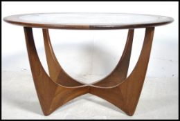 A 1970's teak G Plan teak wood atomic coffee table