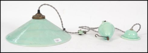 A ceramic rise and fall teal coloured ce