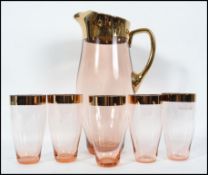 A vintage mid 20th century rose glass lemonade set