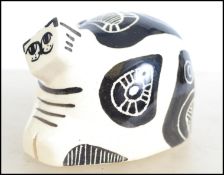 A stunning ceramic Picasso influenced cat having an abstract design in black on white ground