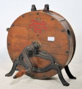 An early 20th century wooden knife sharpener havin