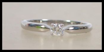 A ladies decorative 18ct white gold single stone d