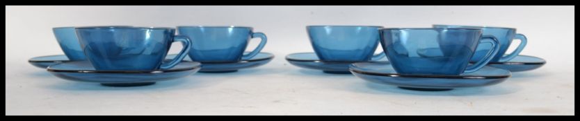 A collection of vinatge / retro 1970's French moulded blue glass cups and saucers. ( six piece