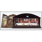 A wooden tryptych opening to reveal ceramic religi