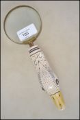 A novelty desk magnifying glass having a handle in the form of a ducks head and neck. Measures