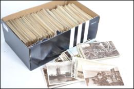 BRITISH POSTCARDS Accumulation of 800 in shoe box.