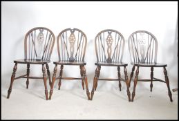 A set of 5 beech and elm wood wheelback dining cha