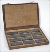 A cased set of Chinese ink blocks, each with decor