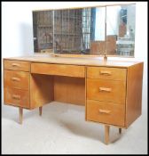 A 1970's retro natural oak mid century pedestal dr