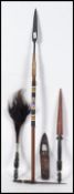 A collection of short African ceremonial spears bo