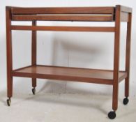A 1970's teak wood butlers serving trolley having