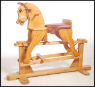 A 20th century wooden pine rocking horse complete