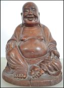 A vintage well carved hard wood laughing Buddha be