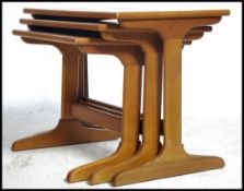 A set retro 20th century teak nest of three inter-