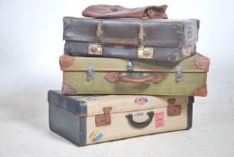 A stack of vintage 20th century travel cases/ suit