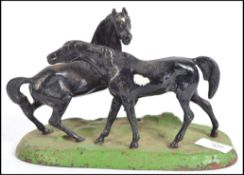 A 20th century cold painted cast metal sculpture s