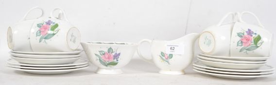 A Susie Cooper tea service consisting of teapot, cups, saucers, creamer and sugar bowl. All