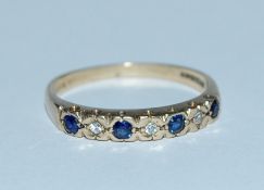 A hallmarked 9ct gold blue sapphire and diamond ha