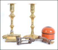 A collection of antique items to include an early 19th century cork screw, a pair of decorative