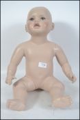 A 20th century  small child / baby mannequin havin